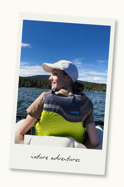 Woman in a kayak on a lake. A Polaroid frame surrounds the photo, and text on the frame reads "nature adventures."